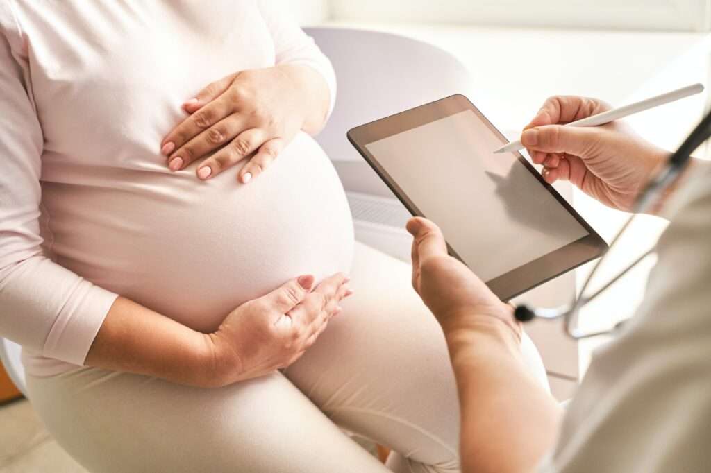 Pregnant woman visit doctor center. Gynecology maternity treatment